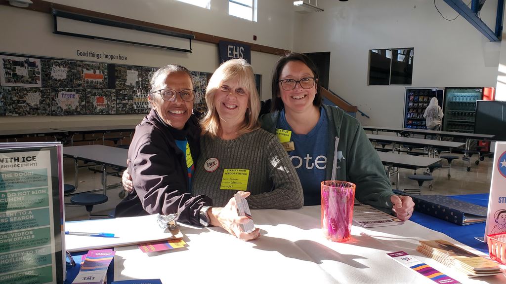 Nadine Shanti, Donna Witte, and Vonita Francisco staff the table at Everett High School.