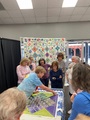Cass doing demo on squaring up a quilt