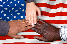 Hands of different skin tones over American flag