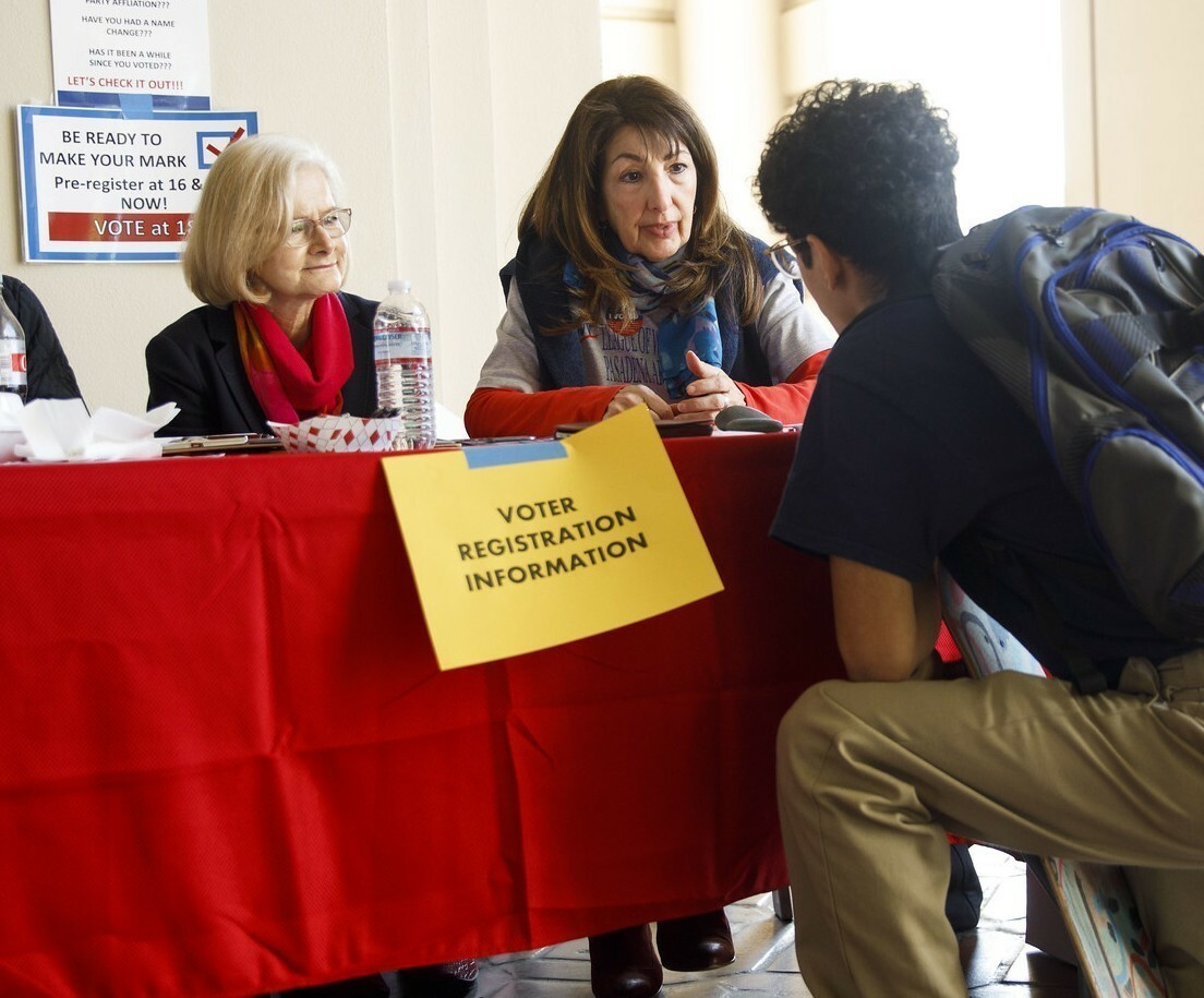 College students at voter registration table
