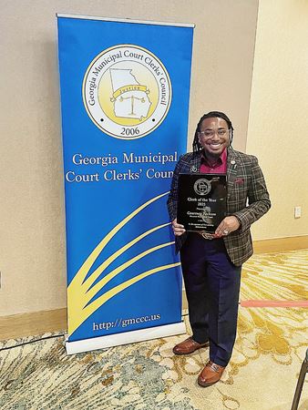 Courtney Jackson receiving the 2025 GMCCC Clerk of the Year Award