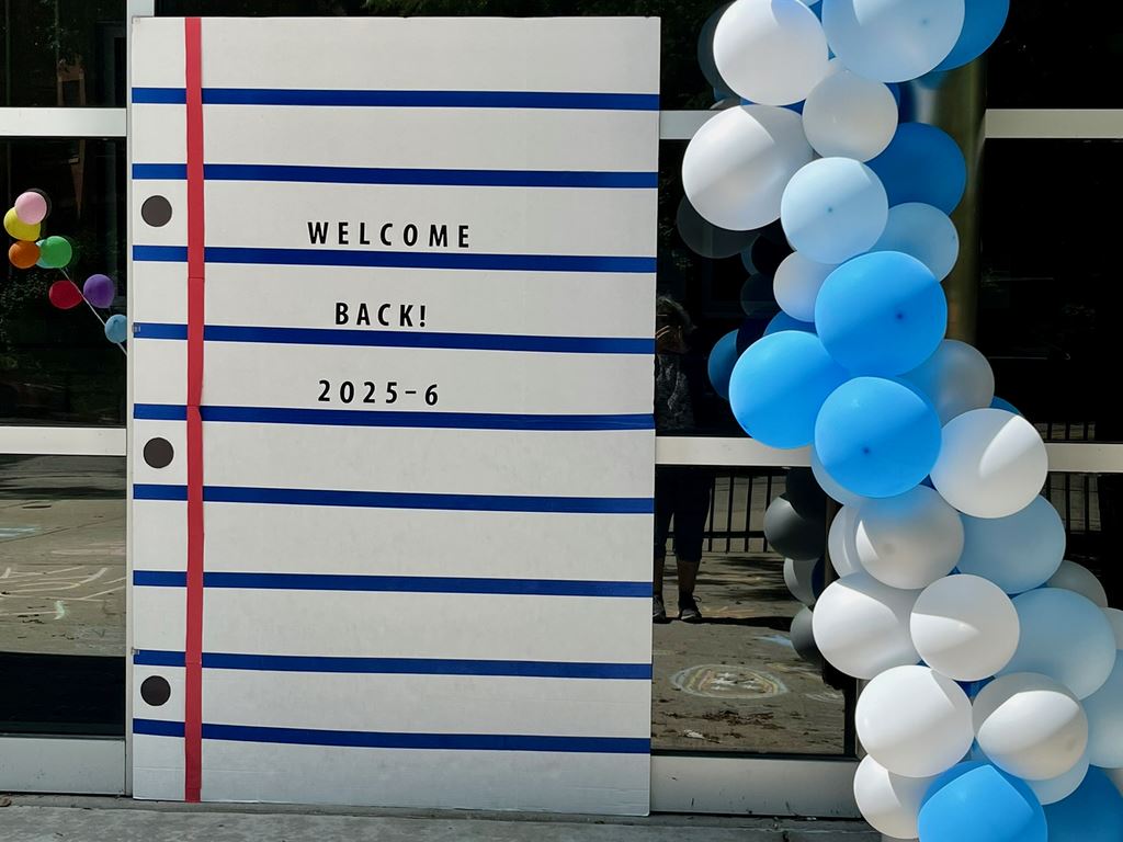 Welcome Back sign w/ balloons