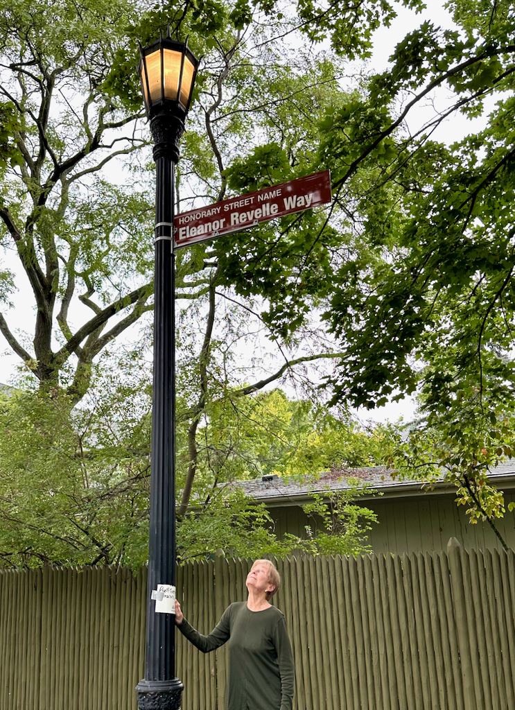 Eleanor Revelle looking at her new honorary street sign from the City of Evanston