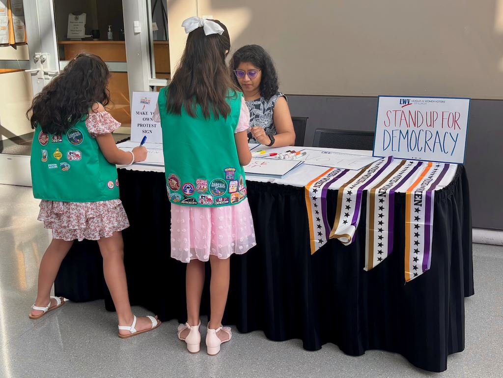Girl Scouts particpate ias future voters.