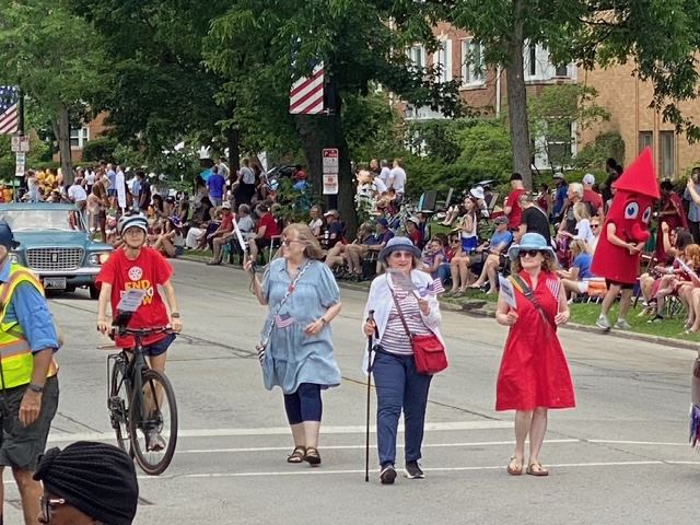 july 4 parade marchers with mascot