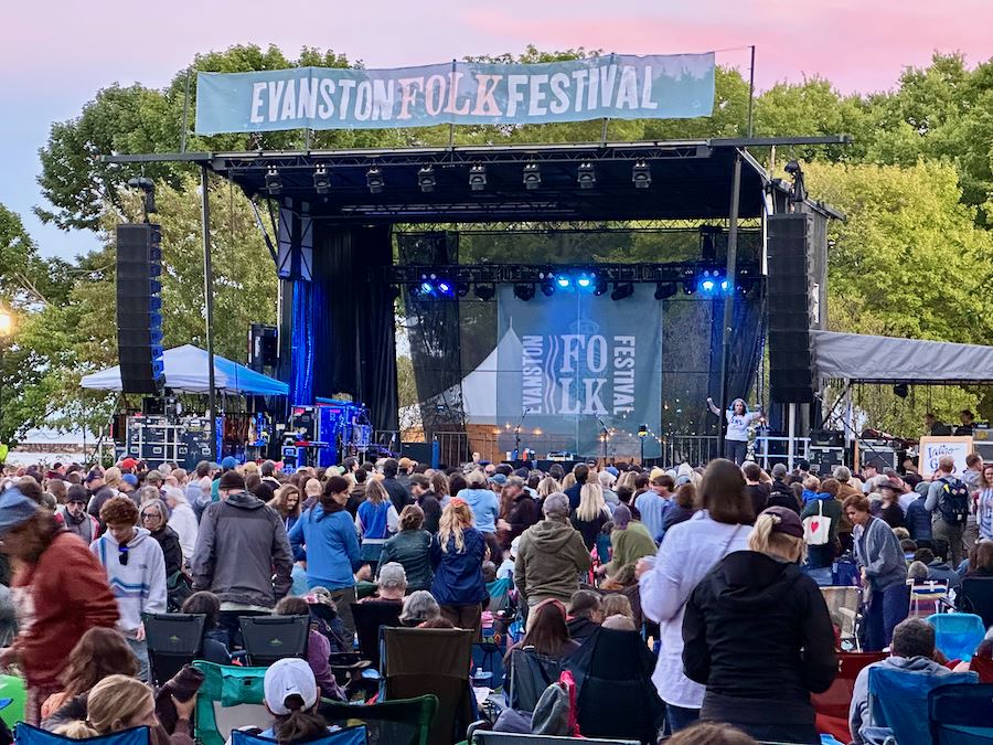 Becky Simon, LWVIL, introduces the Indigo Girls at the Evanston Folk Fest in Dawes Park