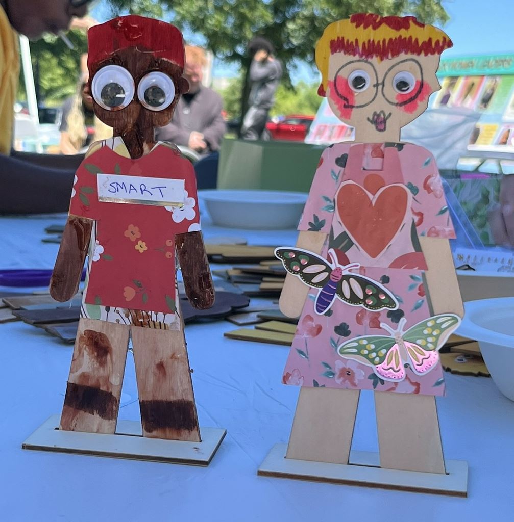 Completed wooden dolls decorated by children