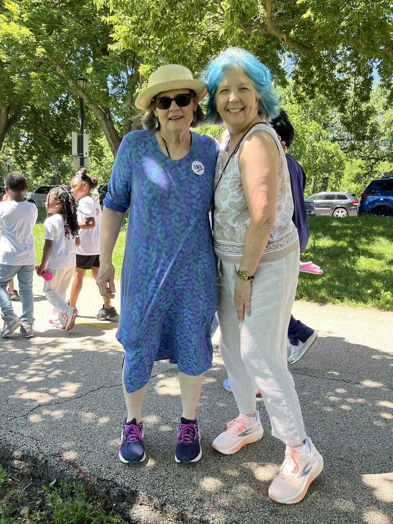 Carol McCardell and Tucker Wildes take a break in the Juneteenth parade