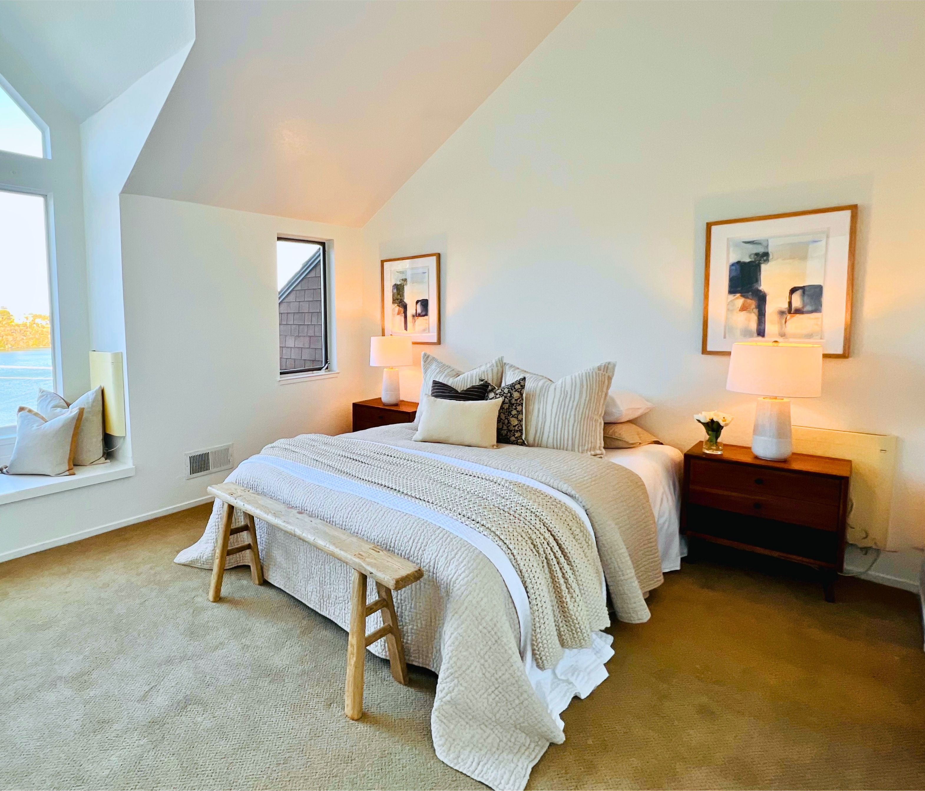 Primary bedroom staged in Sausalito—neutral bedding, warm wood nightstands