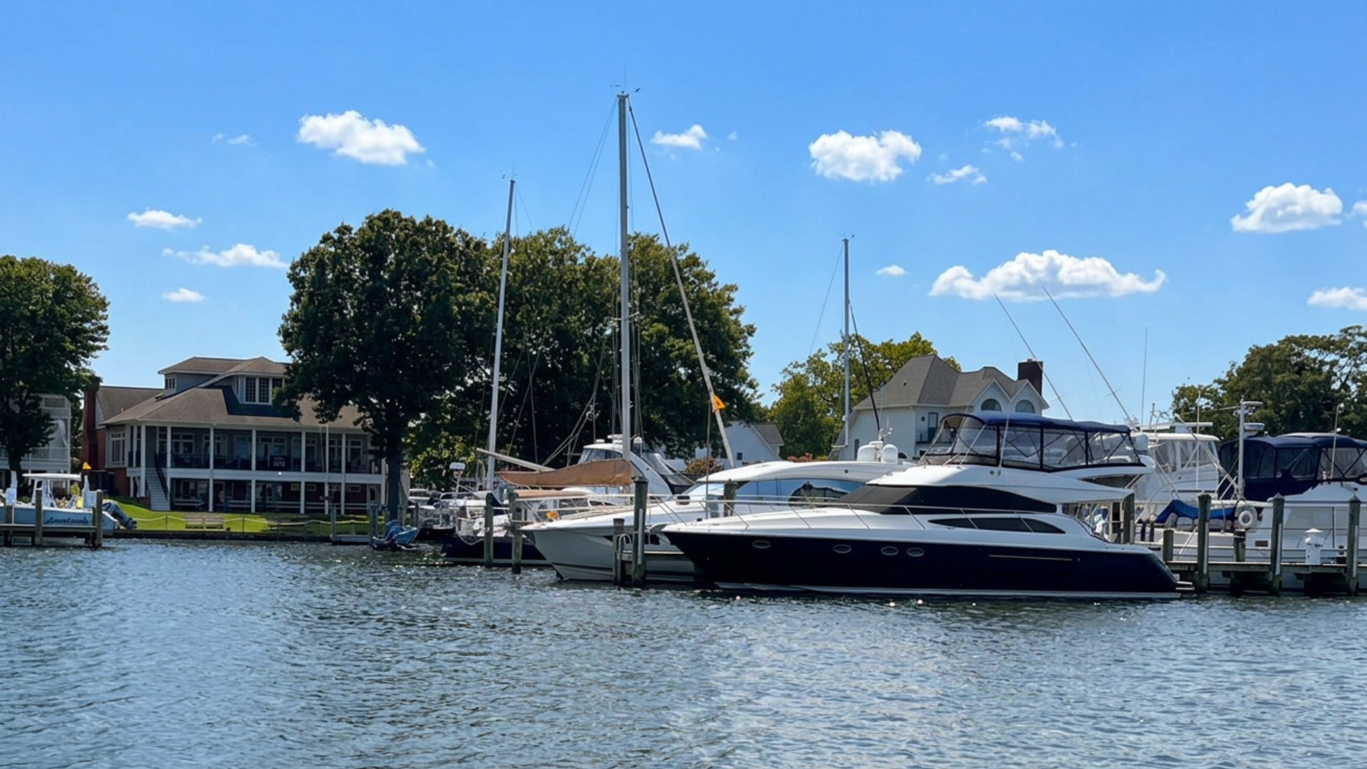 clubhouse with boats on pier
