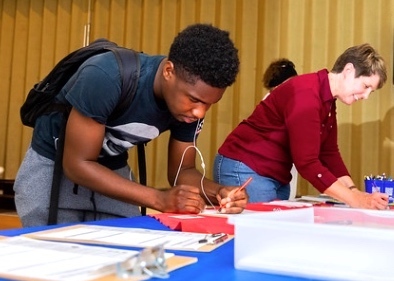 League of Women Voters volunteer registering students to vote