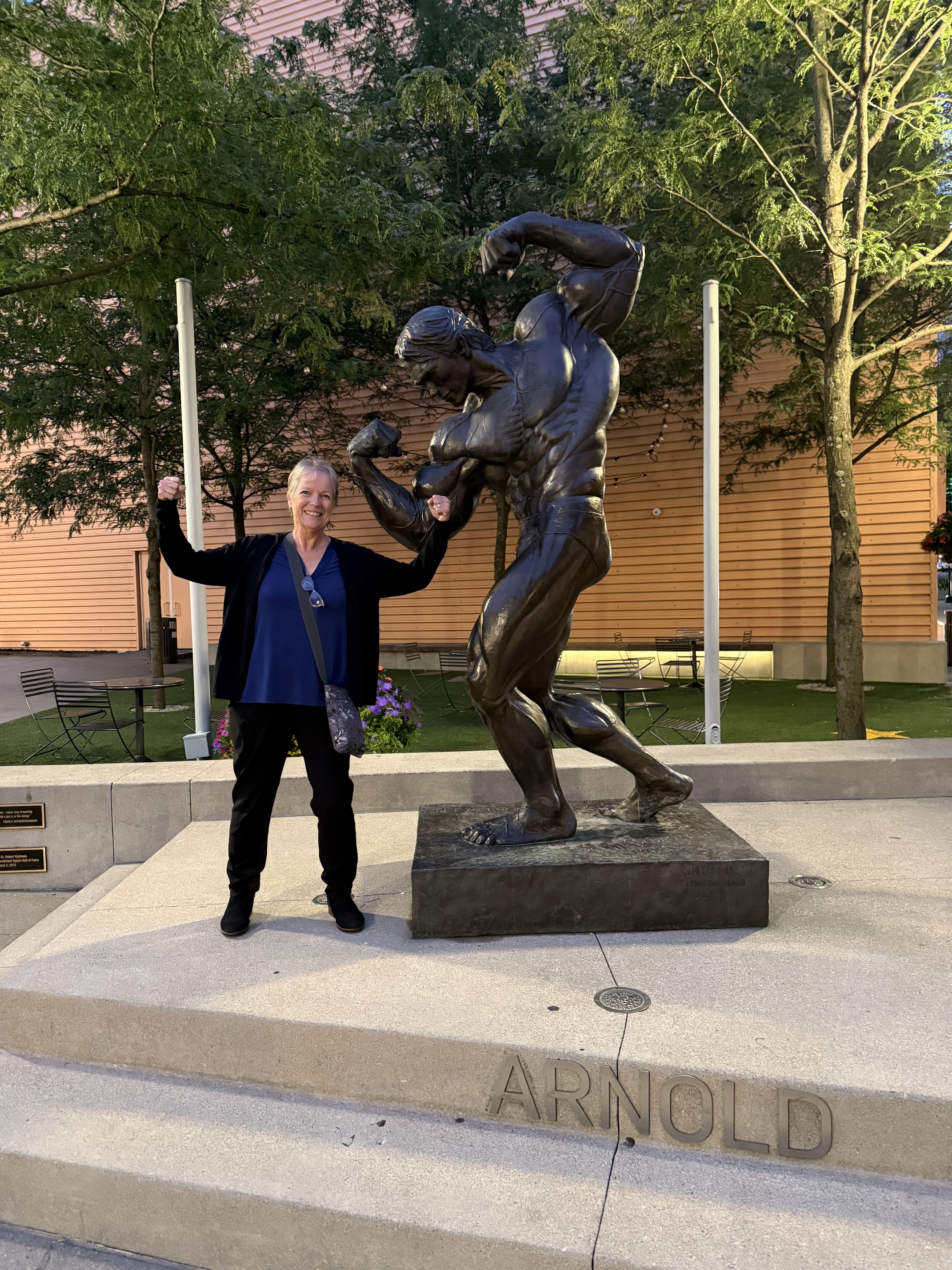 Grace with statue of Arnold Schwarzenegger