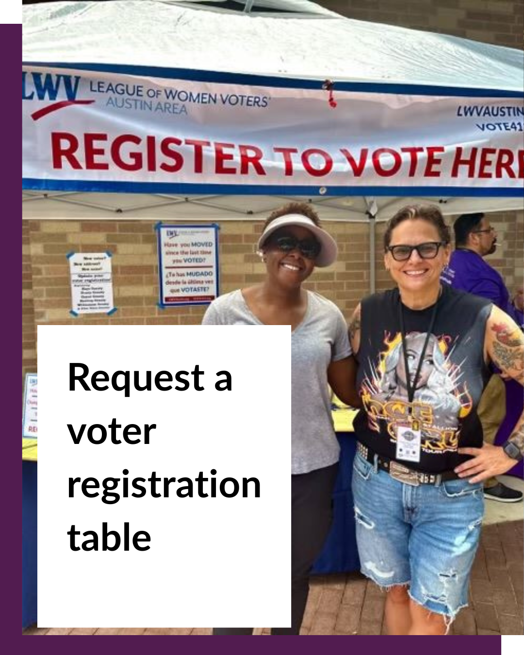 Women smiling in front of a voter registration table