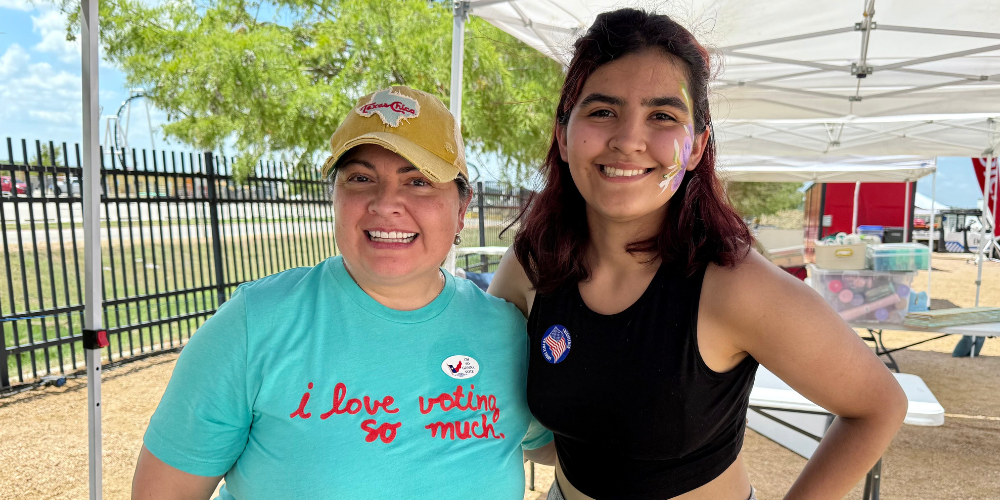 Volunteer registering a first time voter at Dell Valley Day