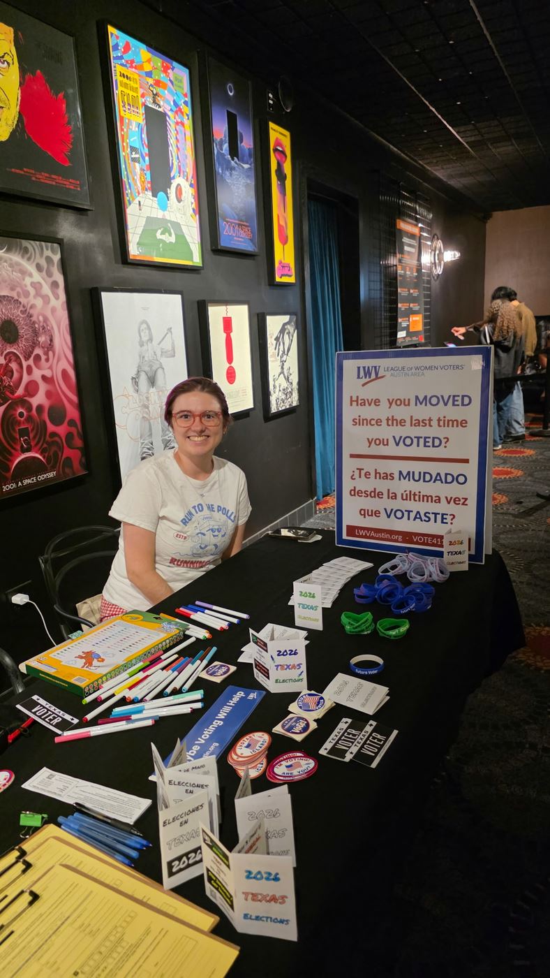 Woman at voter registration table