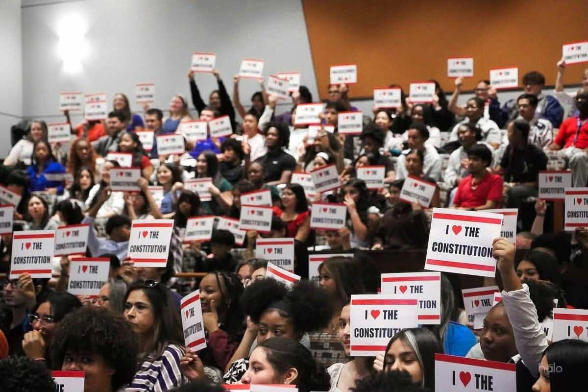 audience_with_signs.jpg