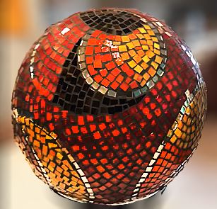 Red, Orange and Black Gazing Ball by Gayle Anderson