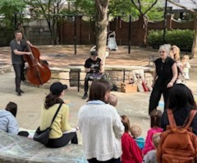 Picture of people listening to music in Goudy Park