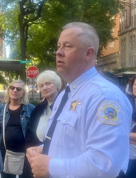 Police officer speaking to a group