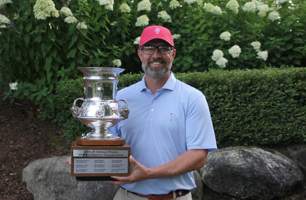 Chet VandenBerg with the Glenn Johnson Trophy