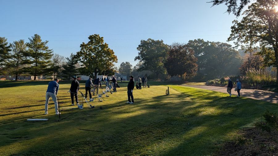Players warming up on the practice range