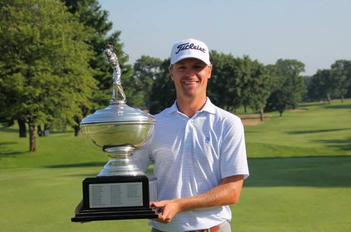 Champion Tim Pearce with the Gilbert A. Currie Trophy