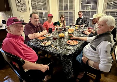 Friends and Host around the table