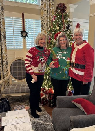 Sandee Dee and Lori Ugly Sweater at Board Meeting