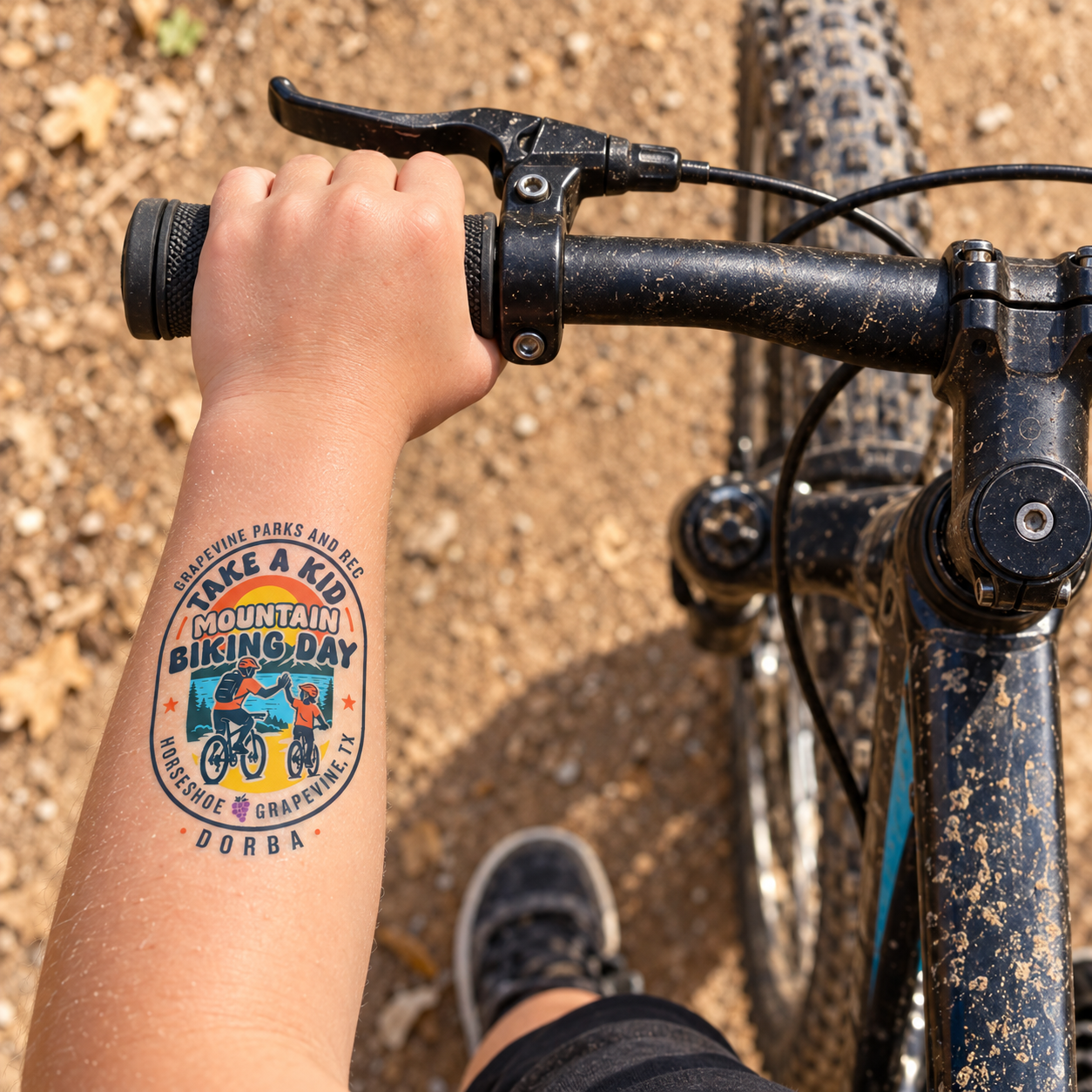 The Take a Kid Mountain Biking Day temporary tattoo