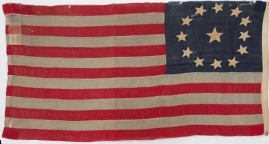 A flag with stars and stripes Description automatically generated with low confidence