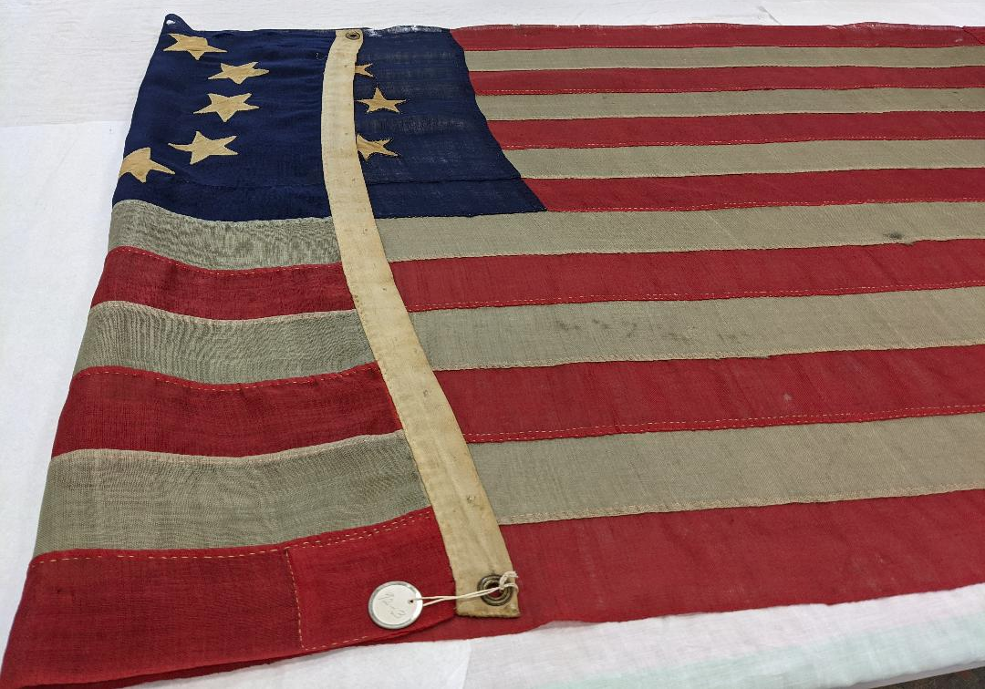 A red and white flag Description automatically generated with medium confidence