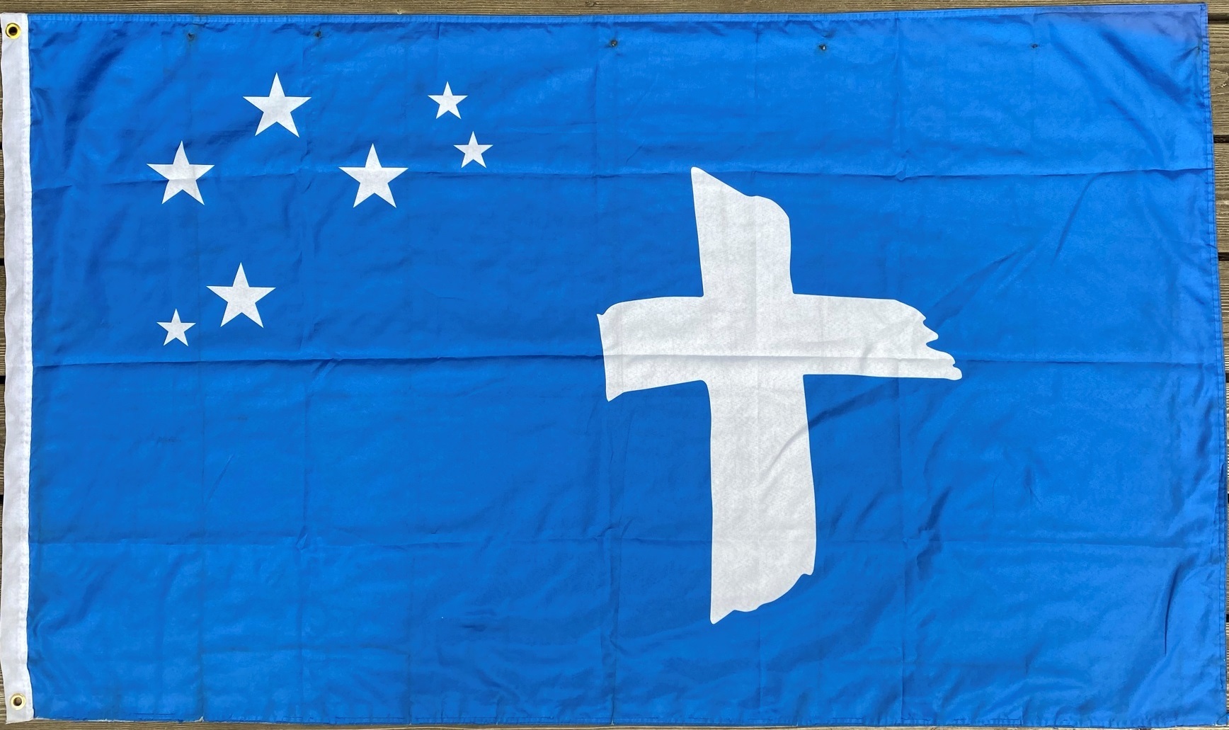 A flag with a star on it Description automatically generated with low confidence