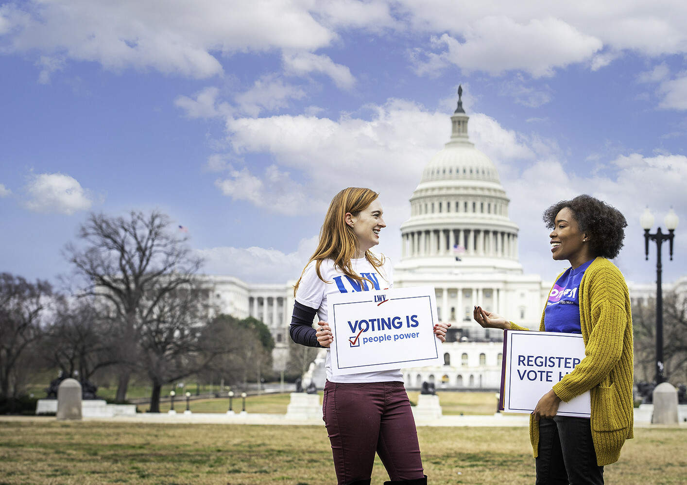 Two women holding signs at the US Capital