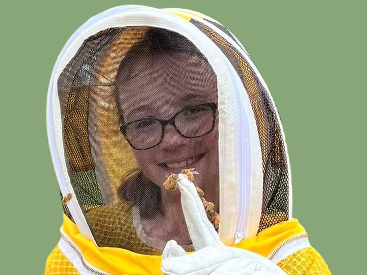 Isabelle with her bees on finger 