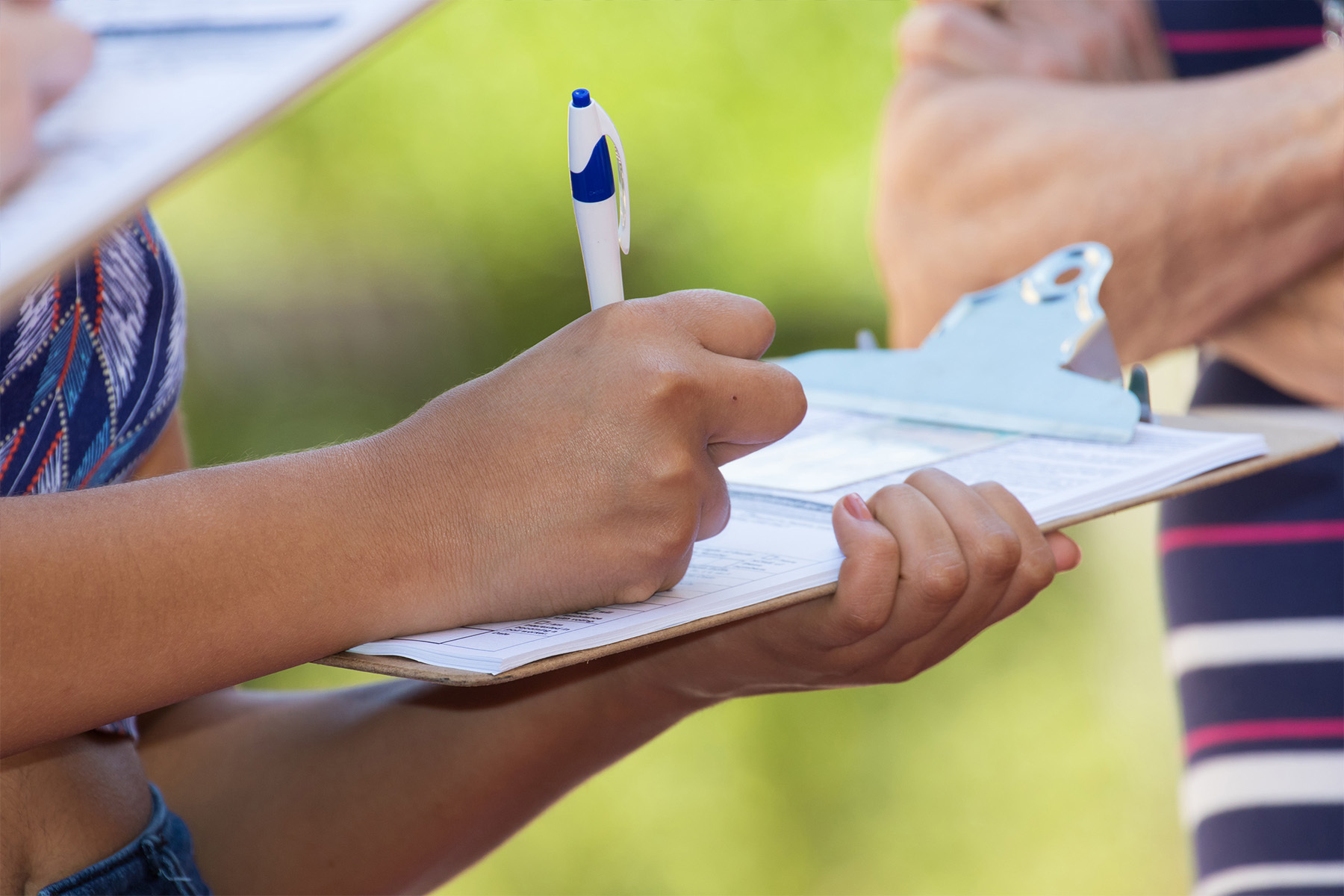 Close up image of young citizen filling out voter registration paperwork