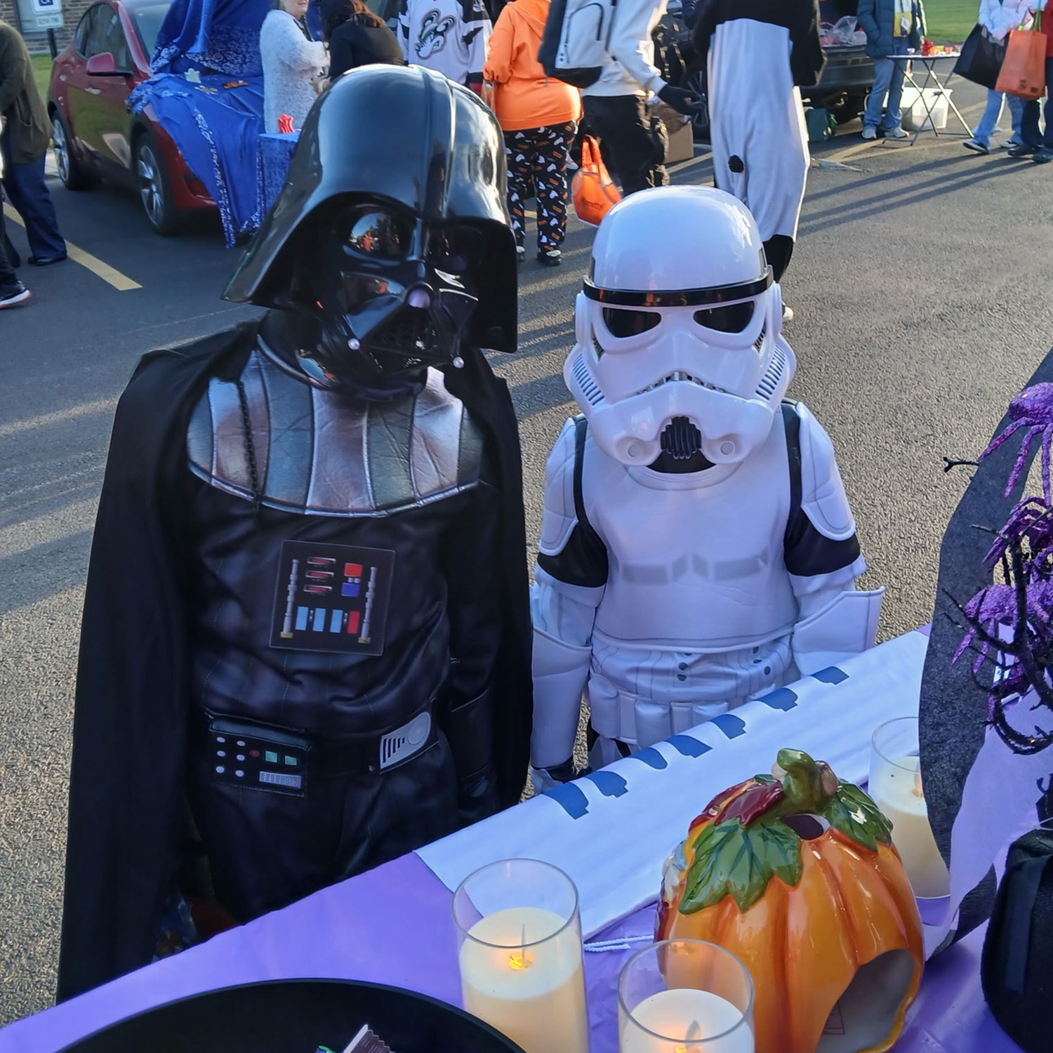 Trick-or-treaters dressed as Star Wars characters visiting the LWV trunk