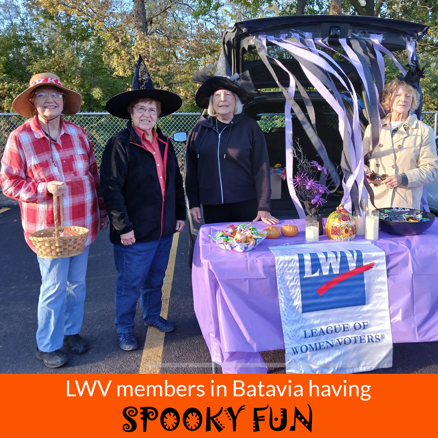 League members posing for picture in front of their decorated trunk