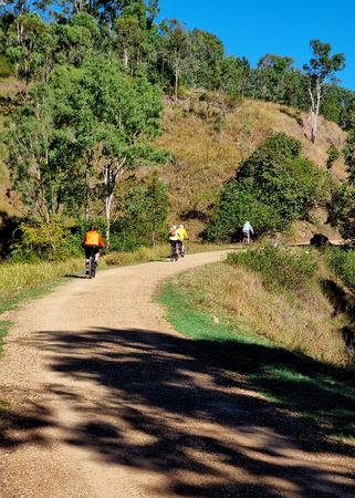 2026 Linville Day 2 - Three Riders on BVRT Gravel Path Below Hillside